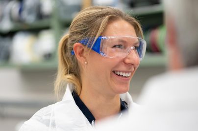 Scientist smiling wearing goggles