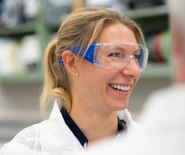 Scientist smiling wearing goggles