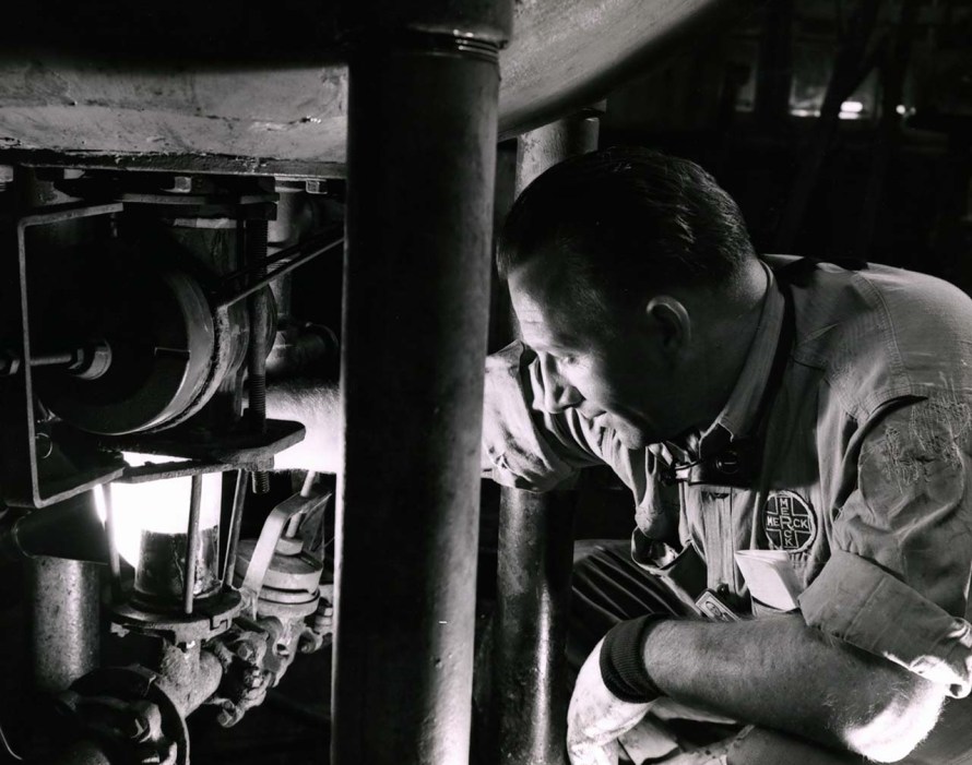 Merck employee working with machinery