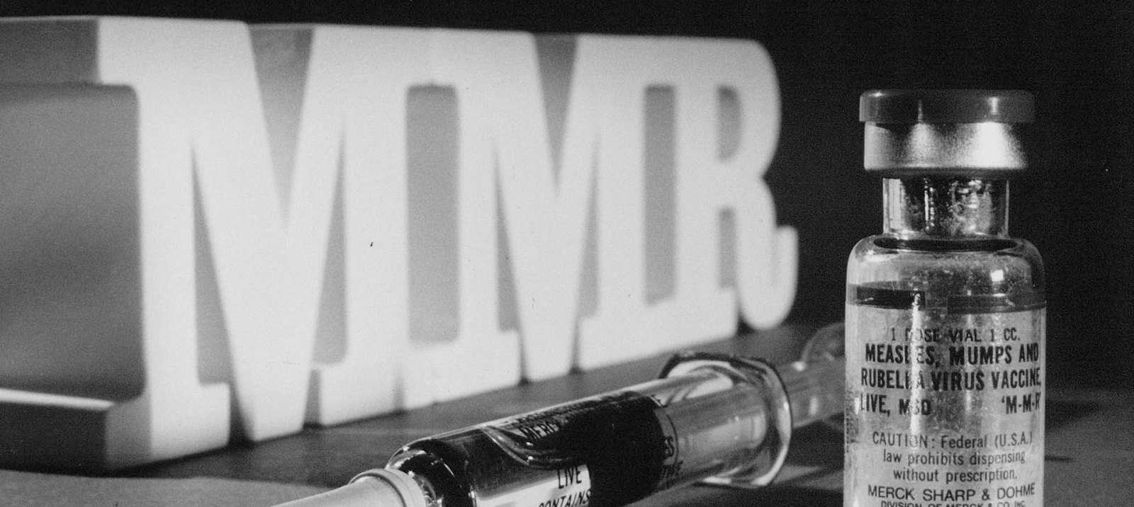 Vial of M-M-R vaccine with syringe