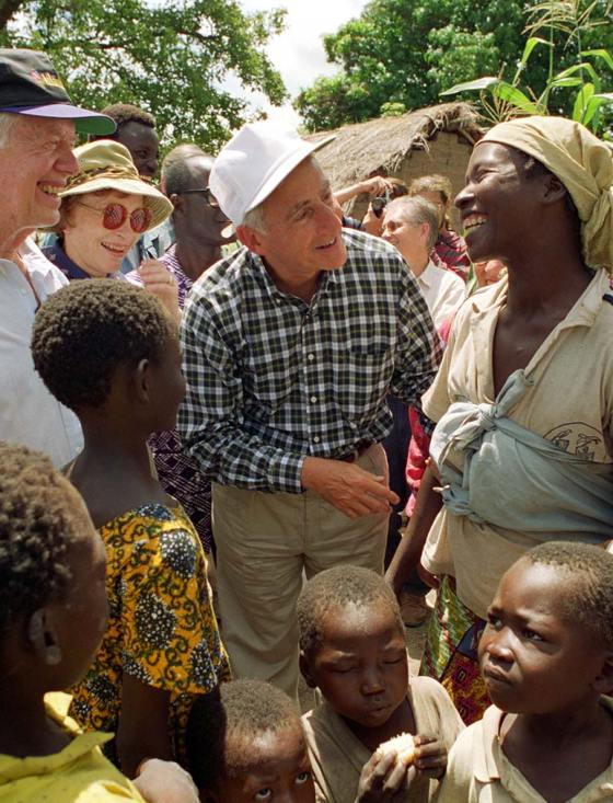 Dr. Roy Vagelos working with African villagers