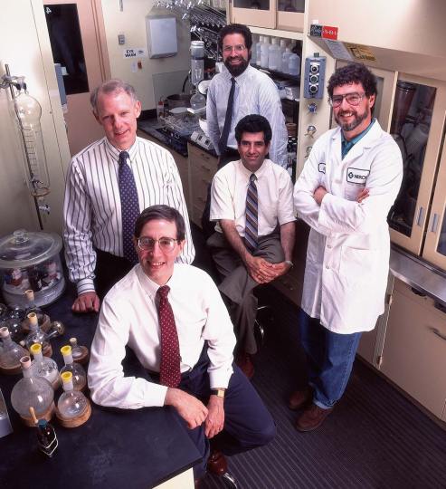 Group of scientists pose in laboratory