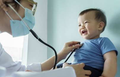 baby being examined by a doctor