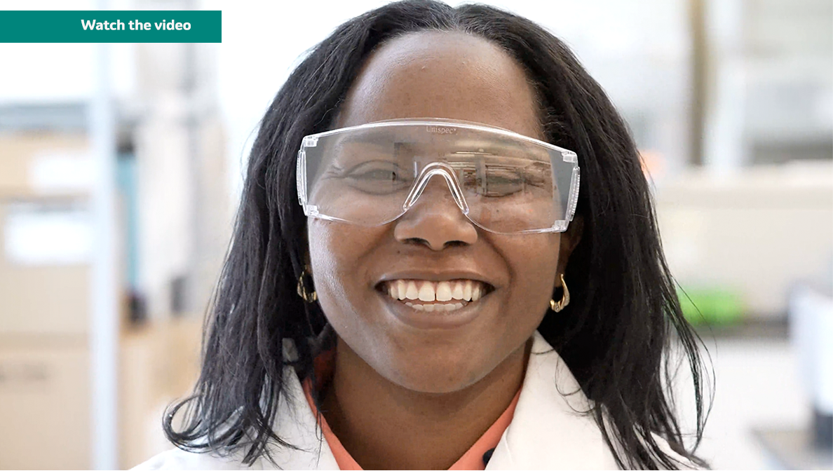 Merck scientist Denarra Simmons wearing goggles and lab coat