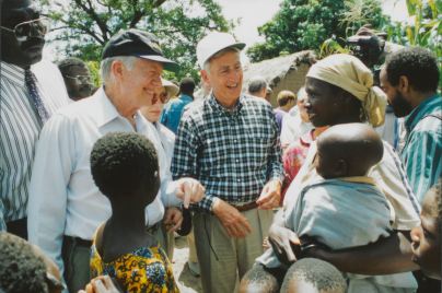 Former President Jimmy Carter and retired Merck CEO Roy Vagelos meet with people affected by river blindness