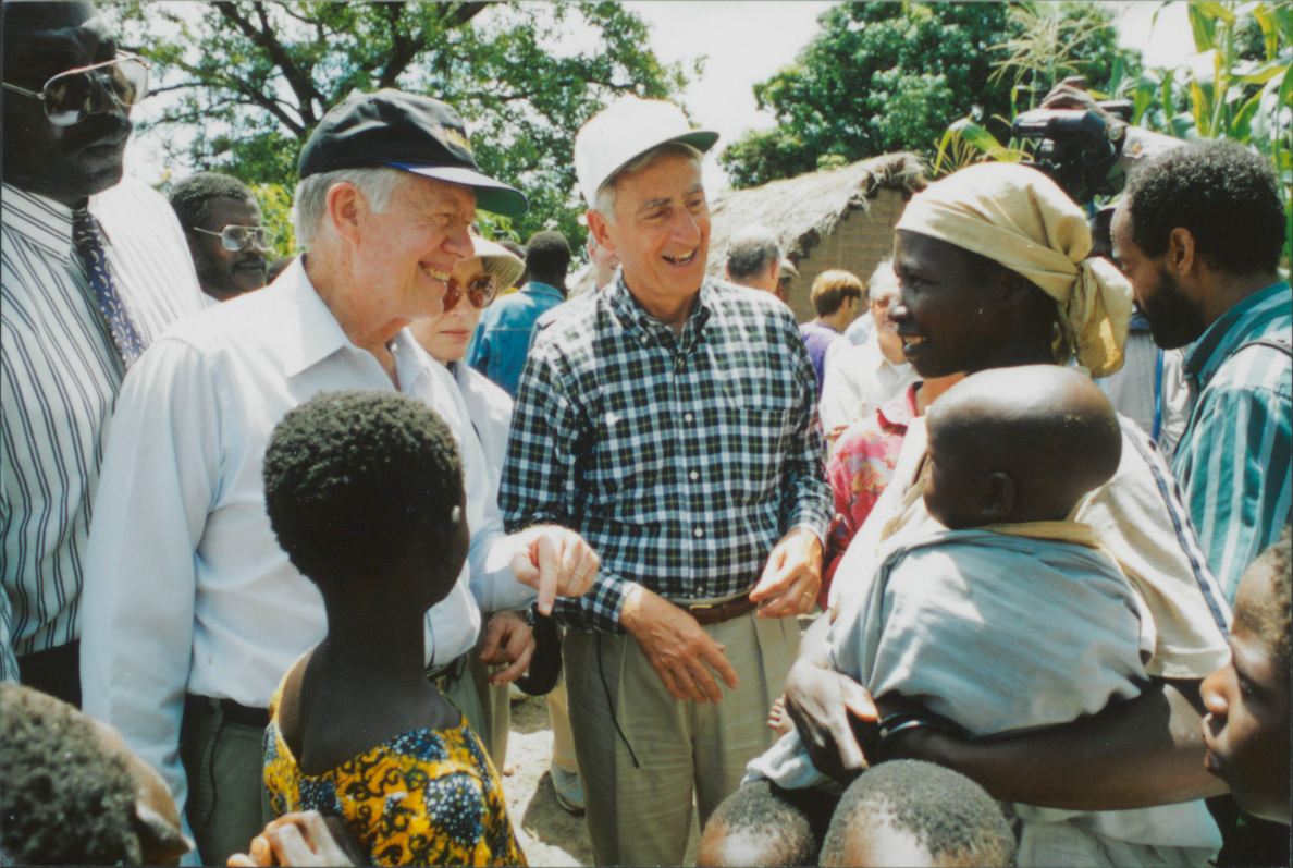 Former President Jimmy Carter and retired Merck CEO Roy Vagelos meet with people affected by river blindness