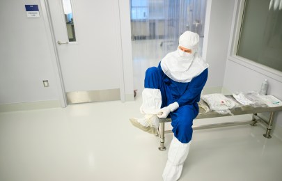 researcher with full protection gear.