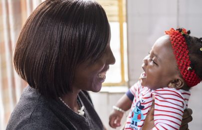 mom and baby smiling at each other