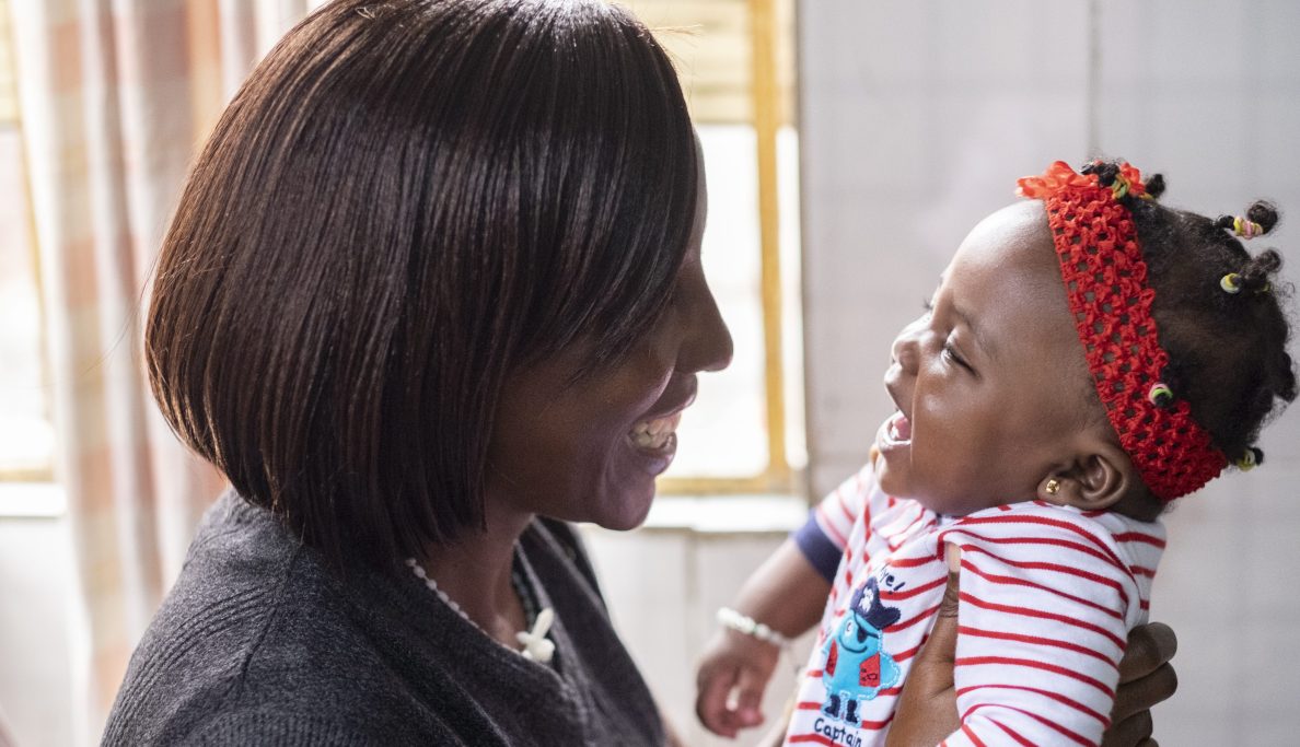 mom and baby smiling at each other