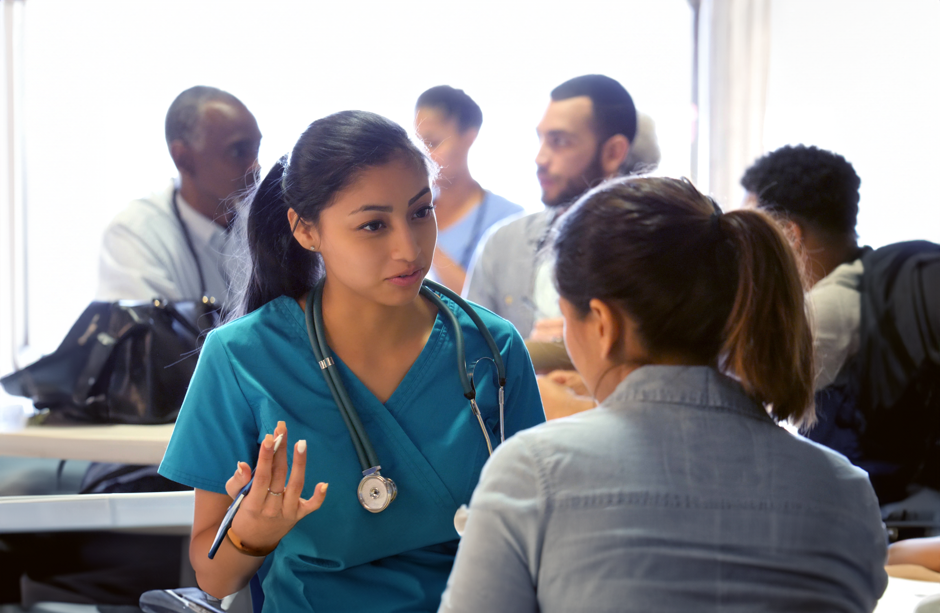 woman talking to health care provider