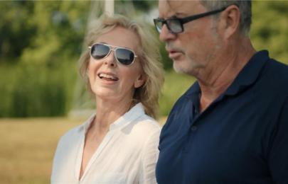 a man and woman smiling and talking