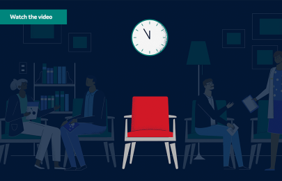 Red chair with clock above it and shadows of patients in the background